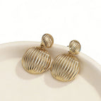 Gold round earrings